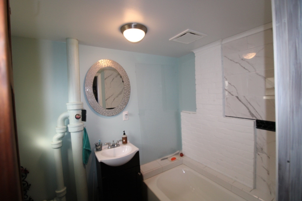 340 Lake Avenue Worcester, MA 01604 - Photo 31 of 37 a bathroom with a sink mirror and toilet