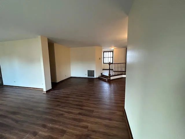 a view of a livingroom with wooden floor