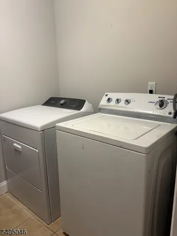 a view of a livingroom with wooden floor and a window