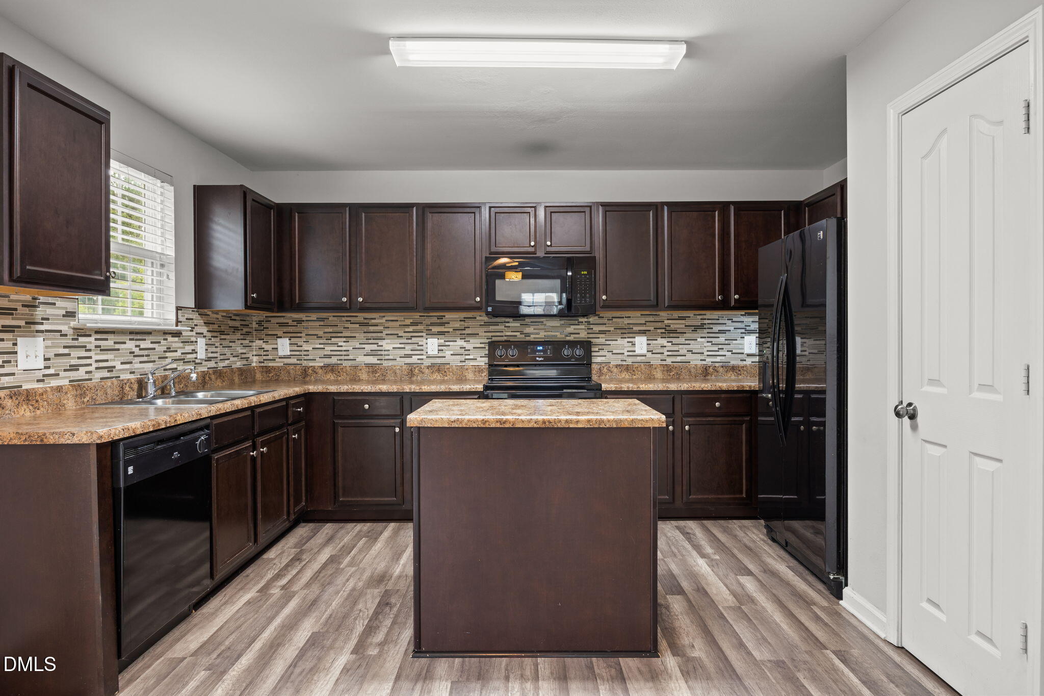 45 Crane Way Bunnlevel, NC 28323 - Photo 12 of 35 a kitchen with stainless steel appliances granite countertop wooden cabinets a stove top oven a sink and dishwasher