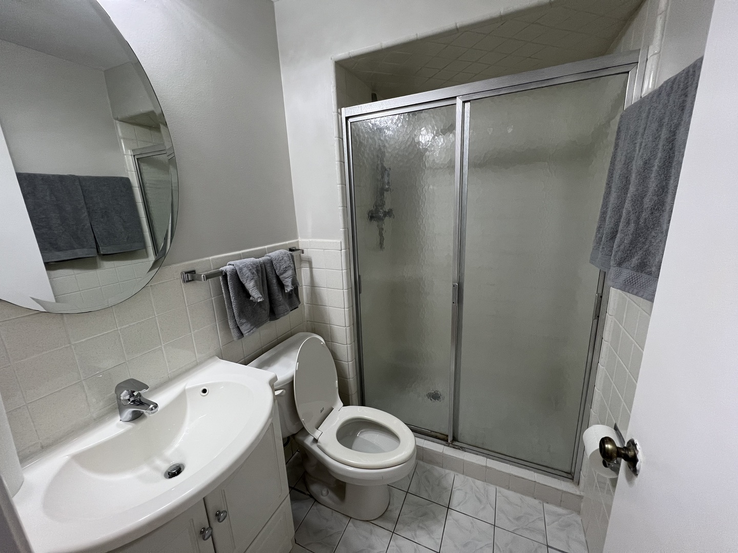 725 Hibbard Road Wilmette, IL 60091 - Photo 13 of 15 a bathroom with a sink toilet and shower