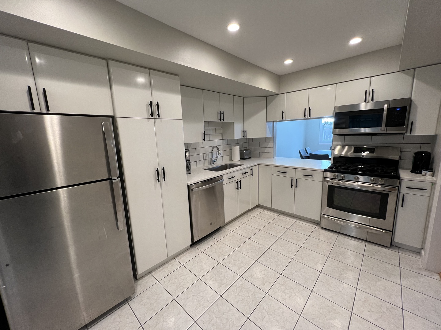 725 Hibbard Road Wilmette, IL 60091 - Photo 15 of 15 a kitchen with stainless steel appliances a refrigerator sink and microwave