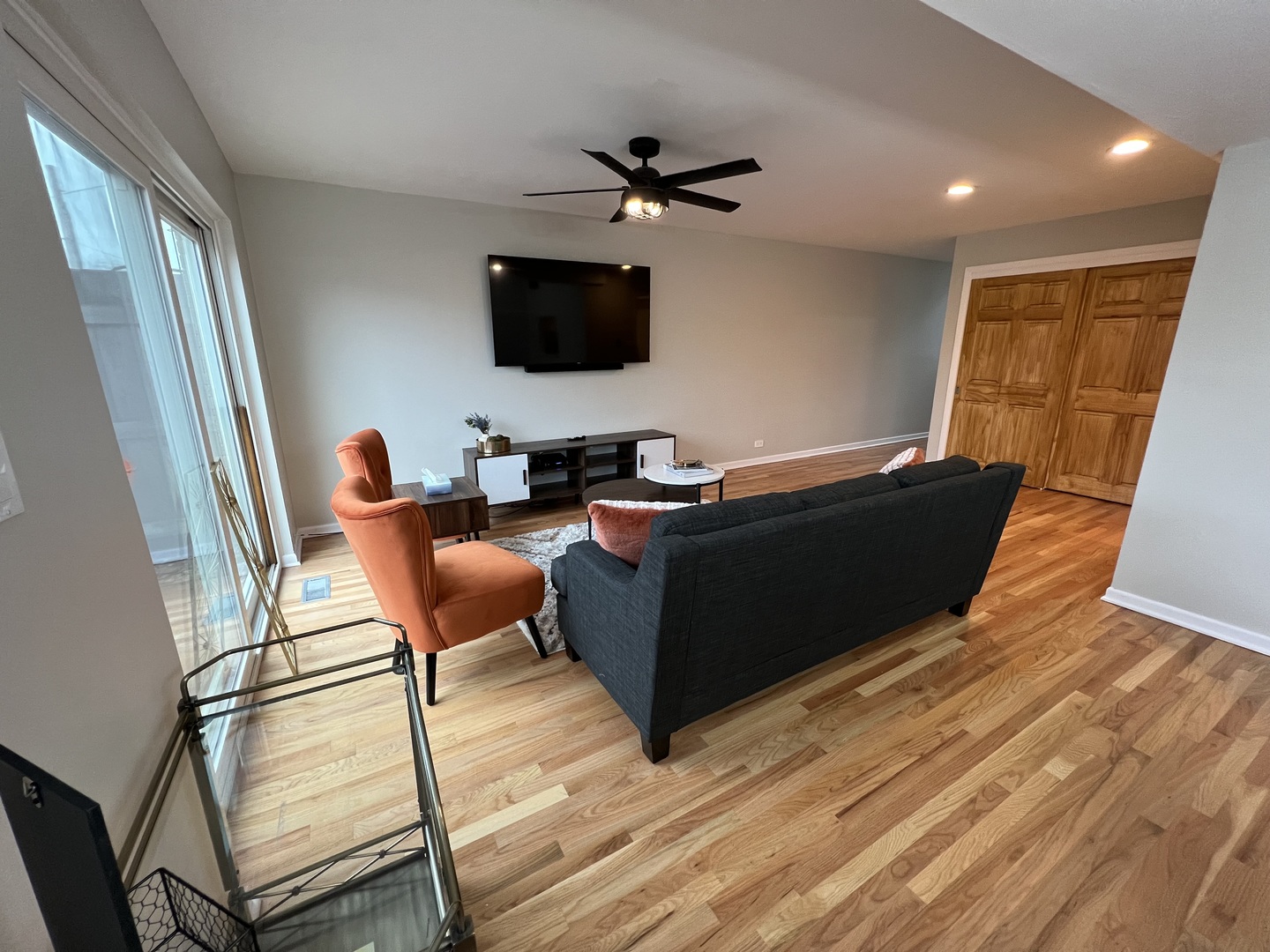725 Hibbard Road Wilmette, IL 60091 - Photo 4 of 15 a living room with furniture and a flat screen tv