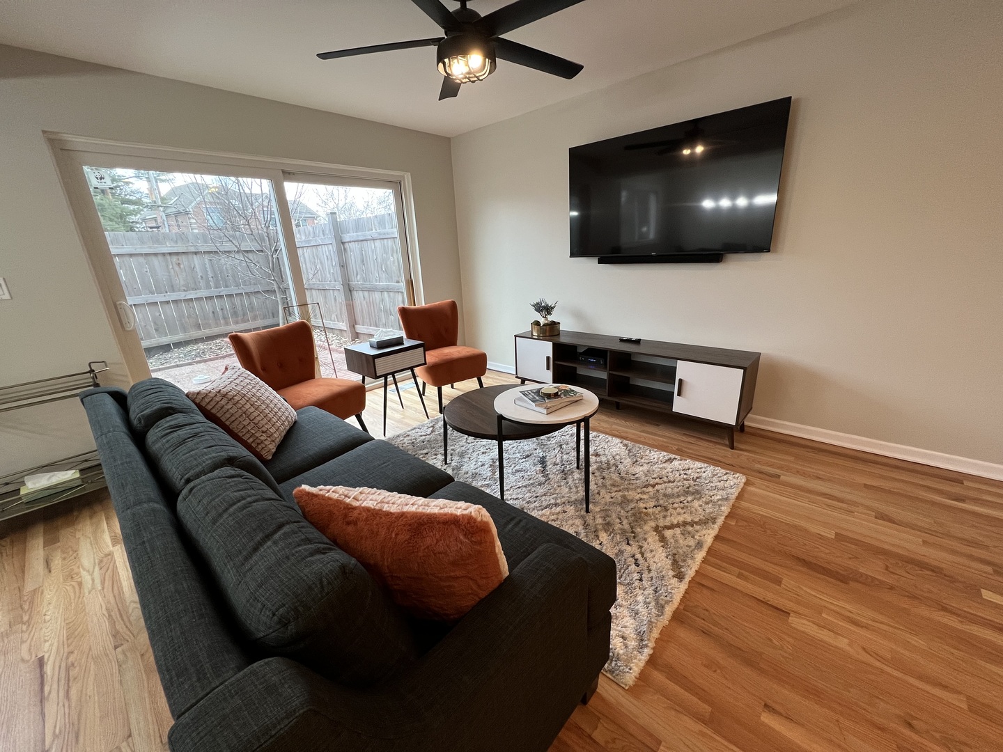725 Hibbard Road Wilmette, IL 60091 - Photo 7 of 15 a living room with furniture and a flat screen tv