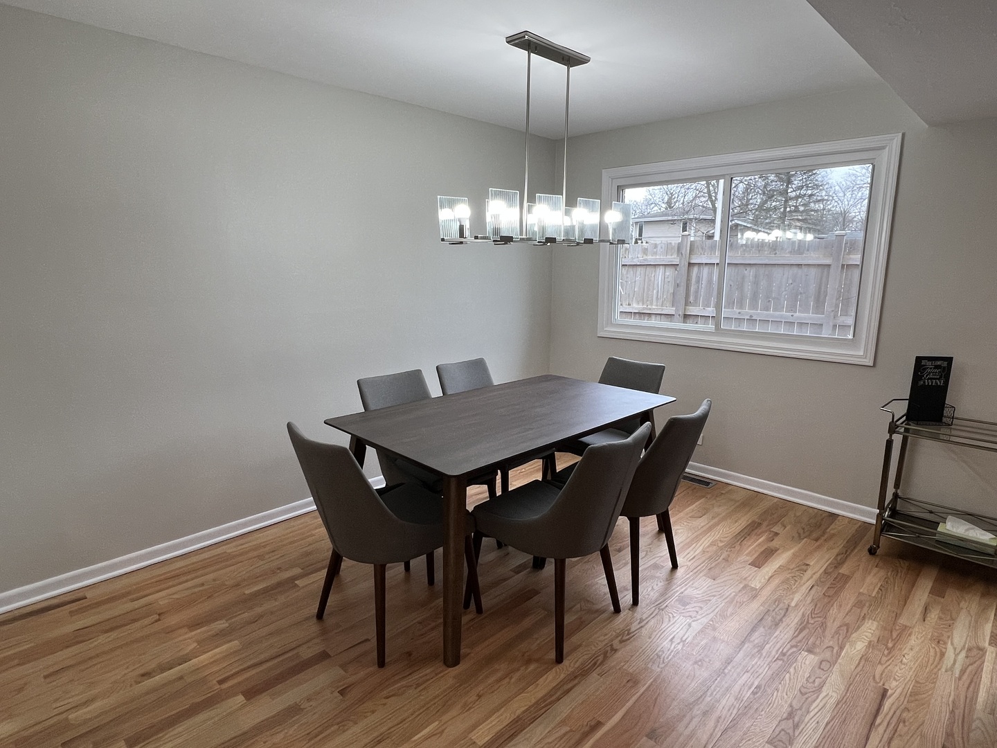 725 Hibbard Road Wilmette, IL 60091 - Photo 8 of 15 a view of a dining room with furniture wooden floor and chandelier