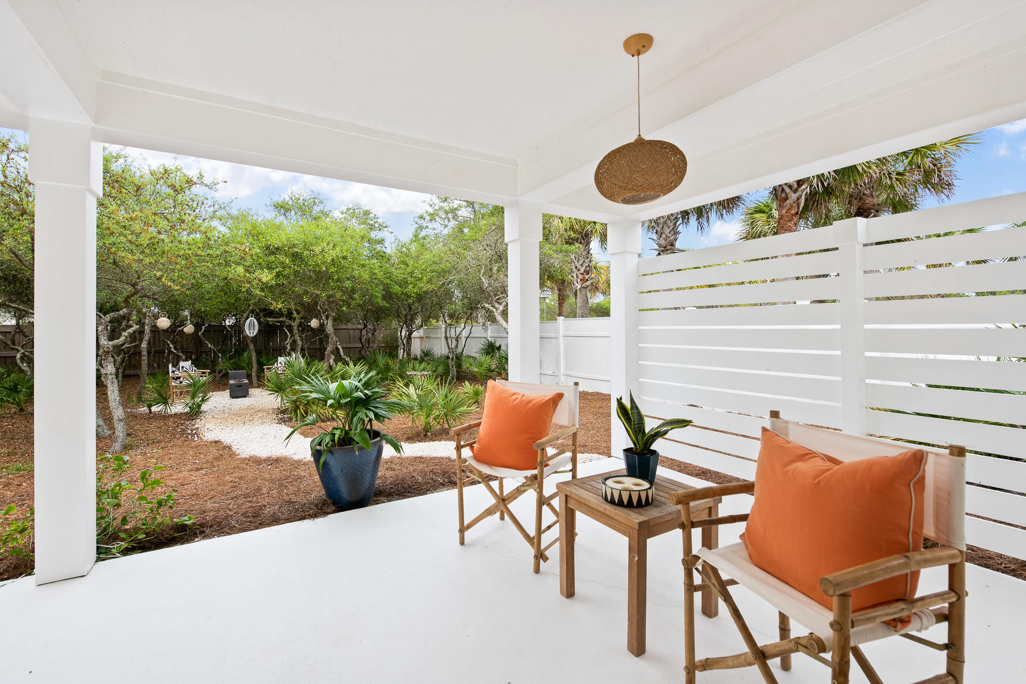 207 Sand Cliffs Drive Inlet Beach, FL 32461 - Photo 6 of 26 a view of a patio with a dining table and chairs