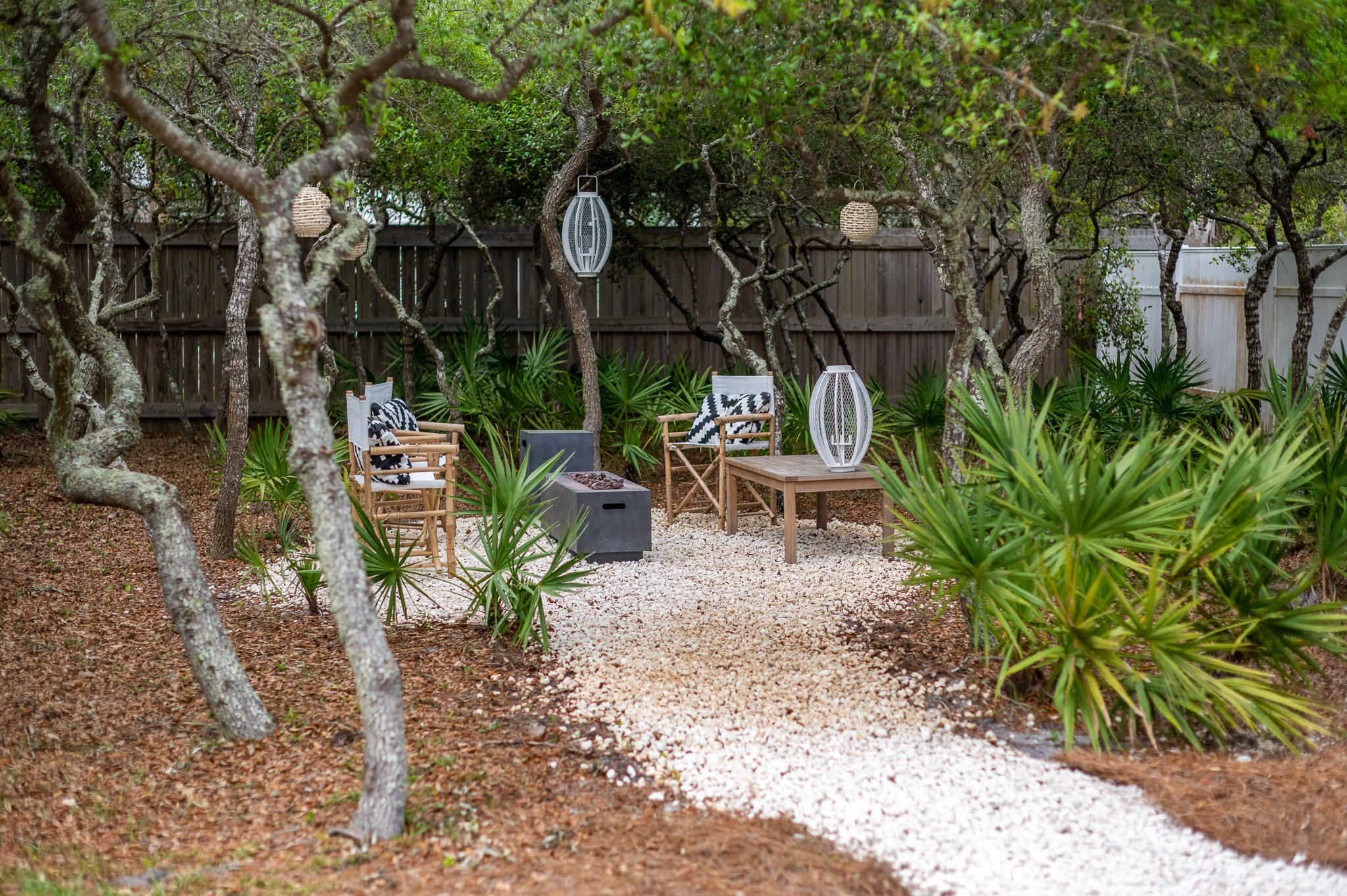 207 Sand Cliffs Drive Inlet Beach, FL 32461 - Photo 8 of 26 a view of a chairs and table in backyard