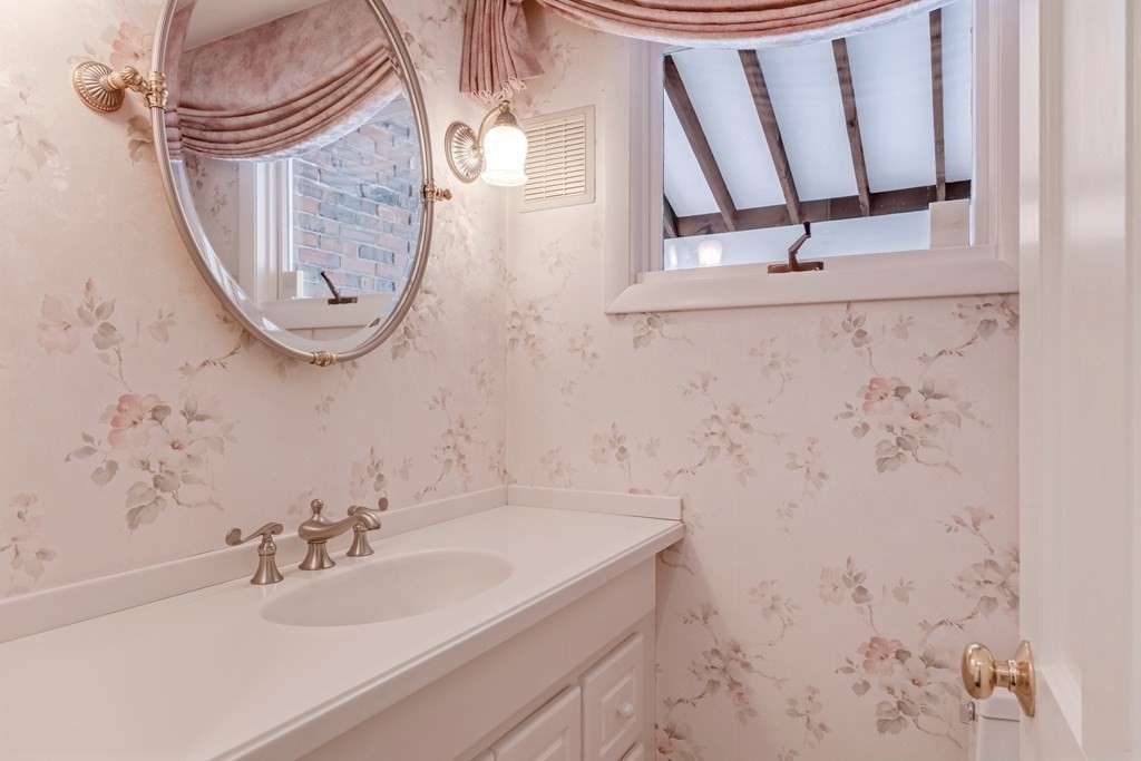 7 Bowser Road Lexington, MA 02420 - Photo 23 of 39 a bathroom with a sink a mirror and vanity