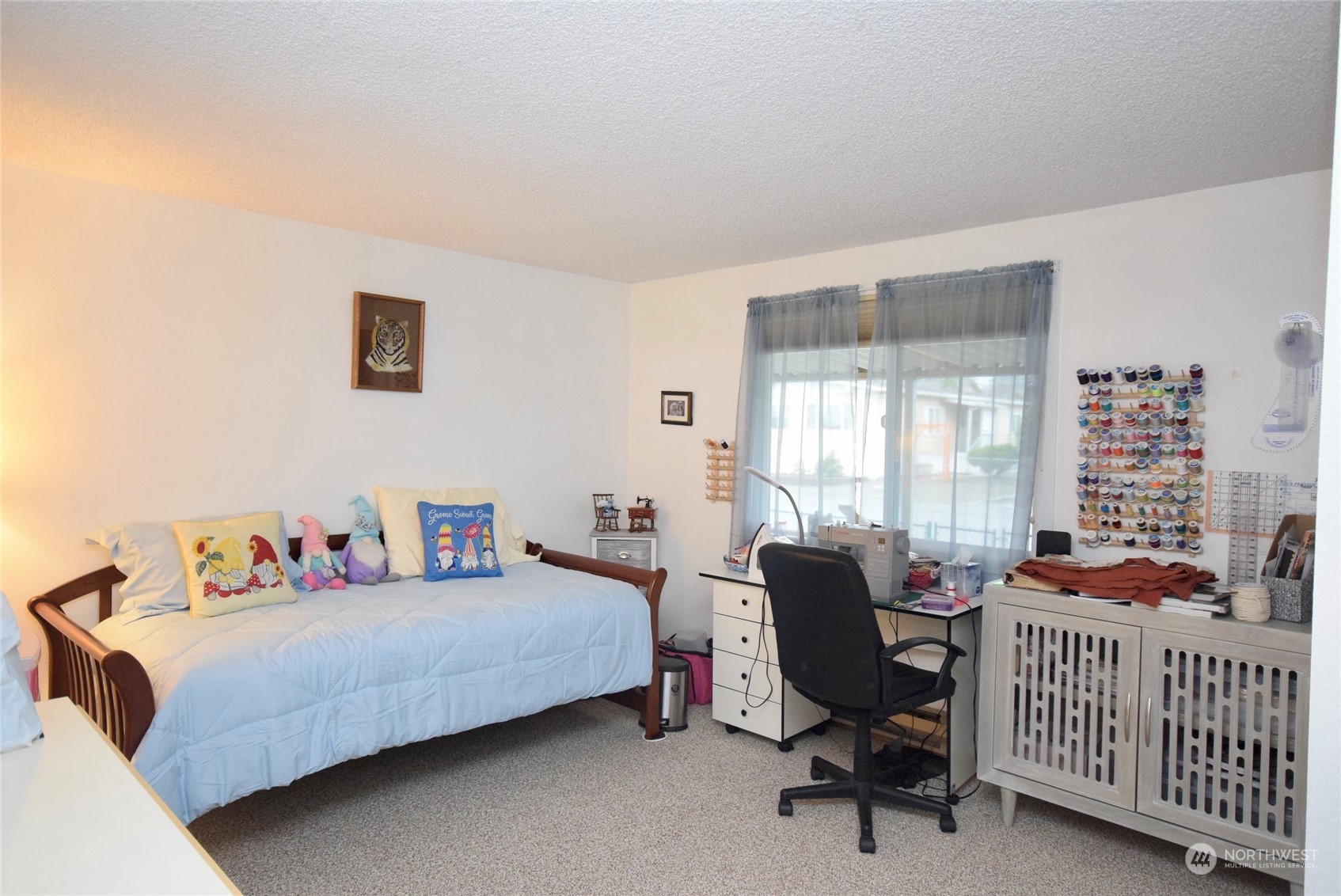 52 Juniper Mobile Estate Sequim, WA 98382 - Photo 15 of 21 a bedroom with a bed and a window