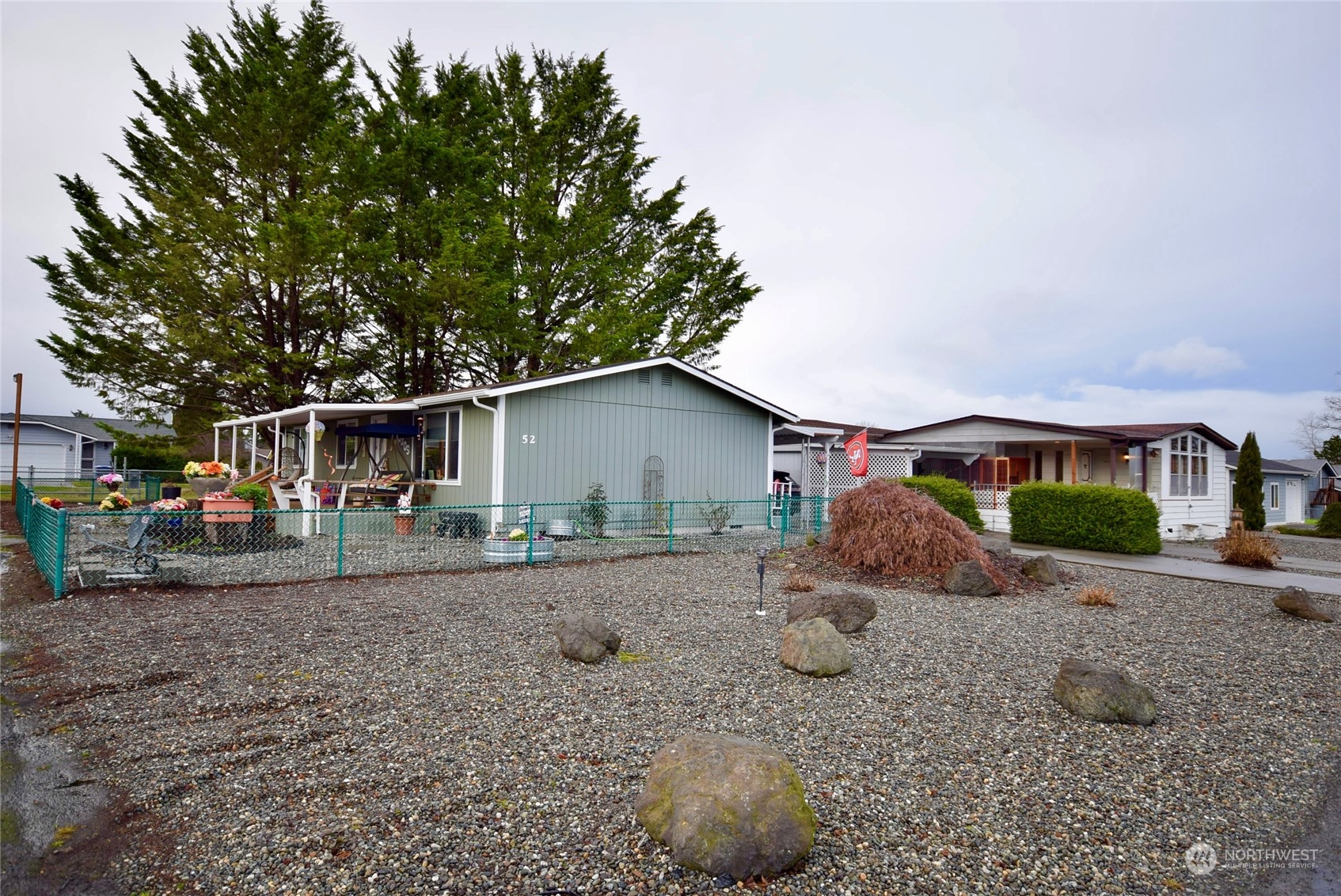 52 Juniper Mobile Estate Sequim, WA 98382 - Photo 3 of 21 a house view with a outdoor space