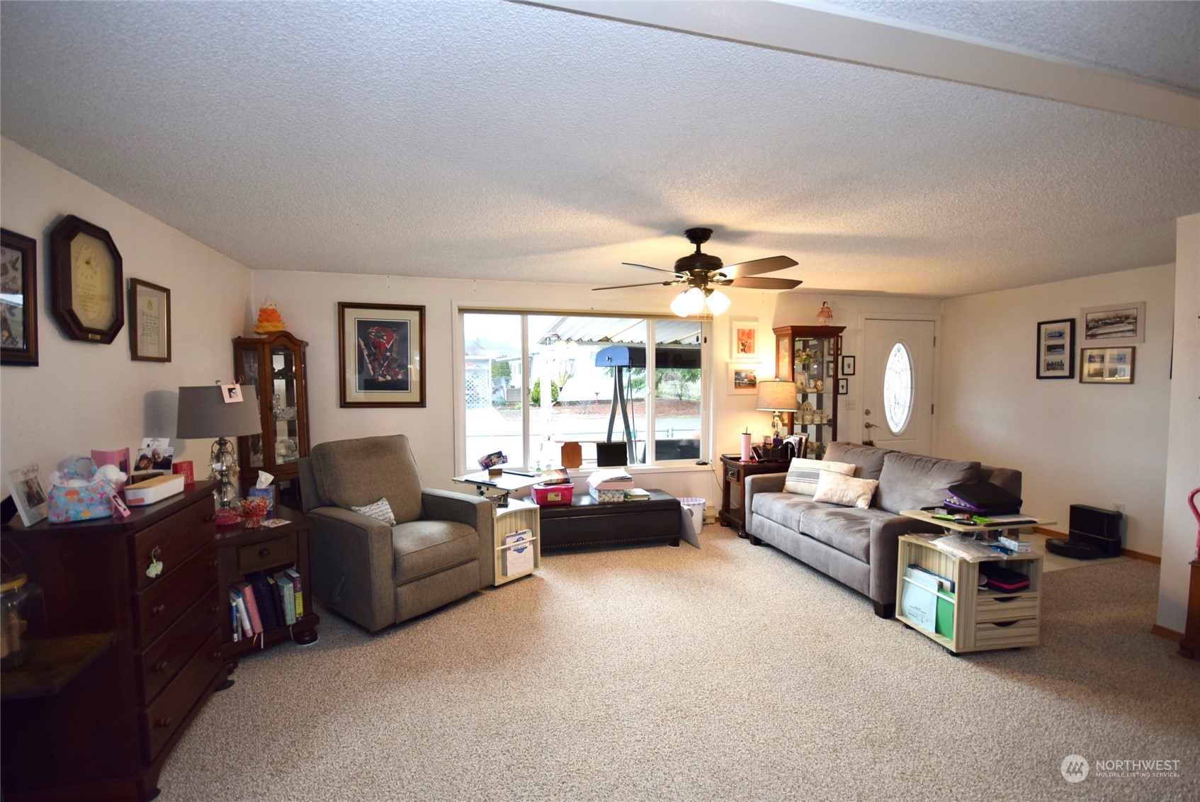52 Juniper Mobile Estate Sequim, WA 98382 - Photo 8 of 21 a living room with furniture and a large window
