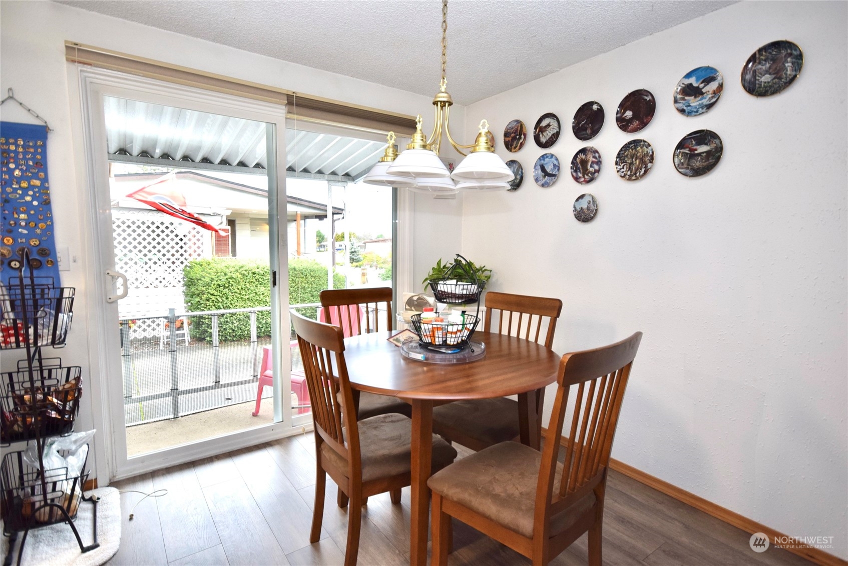 52 Juniper Mobile Estate Sequim, WA 98382 - Photo 9 of 21 a view of a dining room with furniture window and wooden floor