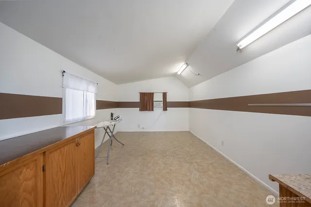 a kitchen with a sink a stove and cabinets