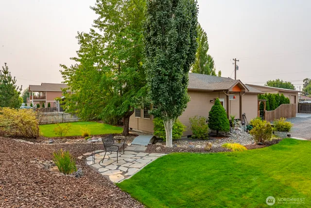 a view of a house with a yard porch and sitting area