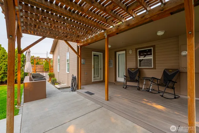 a view of living room with furniture and floor to ceiling window