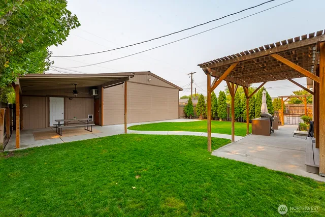a view of a backyard with a garden and plants