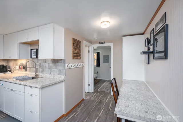 a kitchen with sink cabinets and refrigerator
