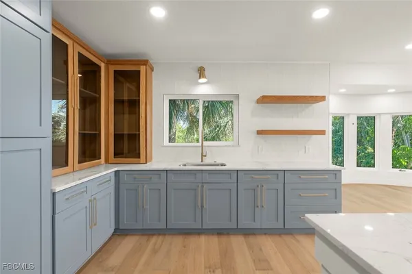 a kitchen with a sink and cabinets