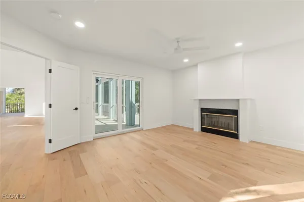 a view of empty room with a fireplace