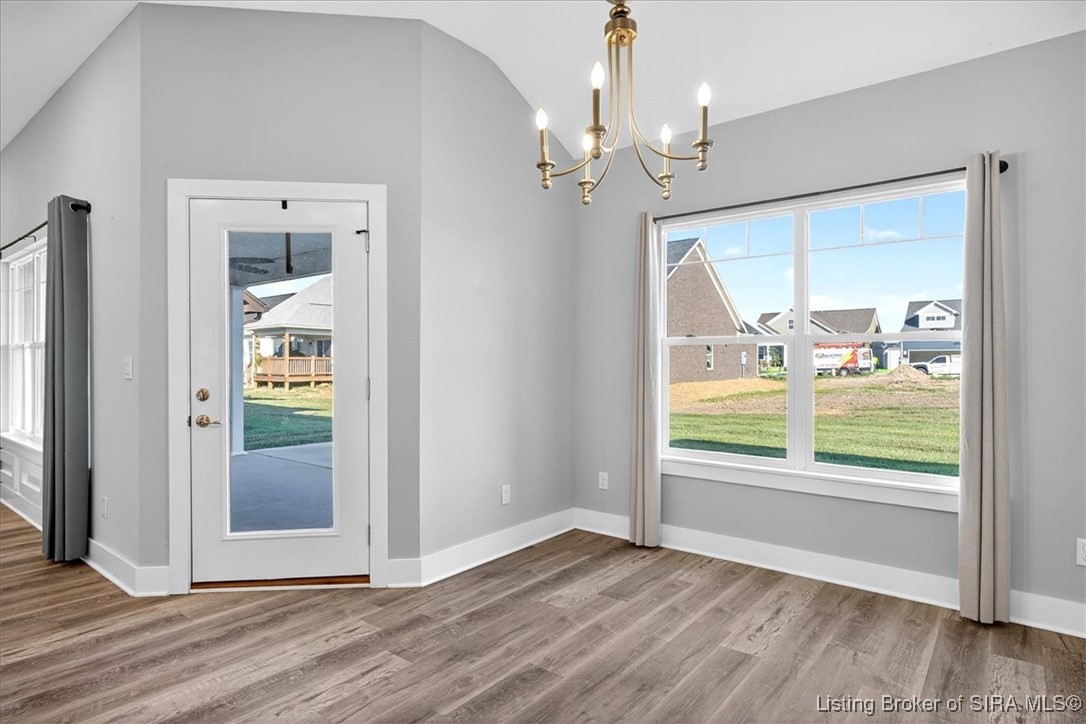 7808 Linwood Circle Charlestown, IN 47111 - Photo 16 of 36 Open dining room with access to the covered patio.