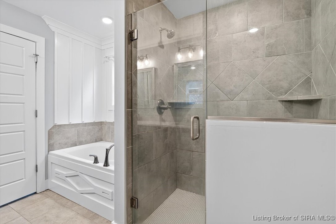7808 Linwood Circle Charlestown, IN 47111 - Photo 22 of 36 Primary bathroom features a garden tub and large walk-in shower