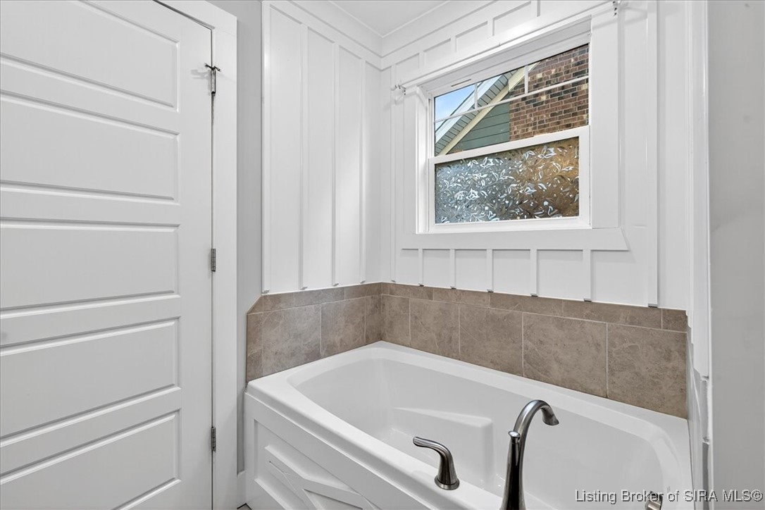 7808 Linwood Circle Charlestown, IN 47111 - Photo 23 of 36 Primary bathroom features a garden tub and large walk-in shower