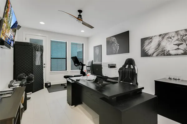 a living room with furniture and flat screen tv