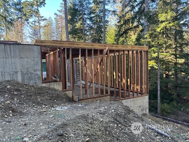 821 East Olde Lyme Road Shelton, WA 98584 - Photo 28 of 33 a view of a backyard with large trees and wooden fence