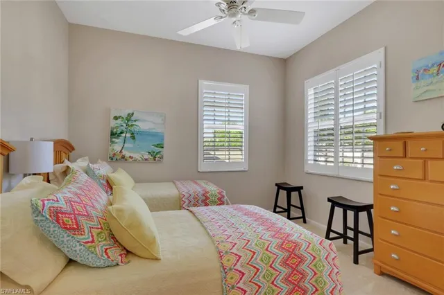 a bedroom with a bed and a table in it