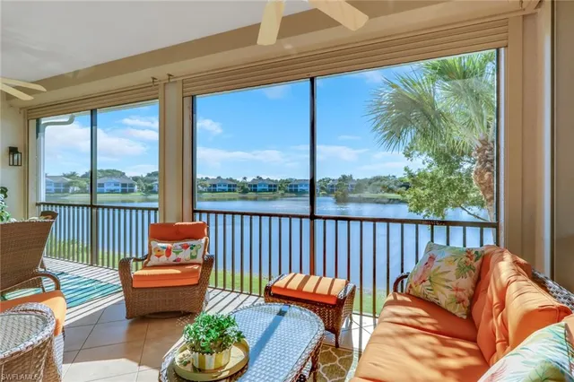 a balcony with furniture and a potted plant