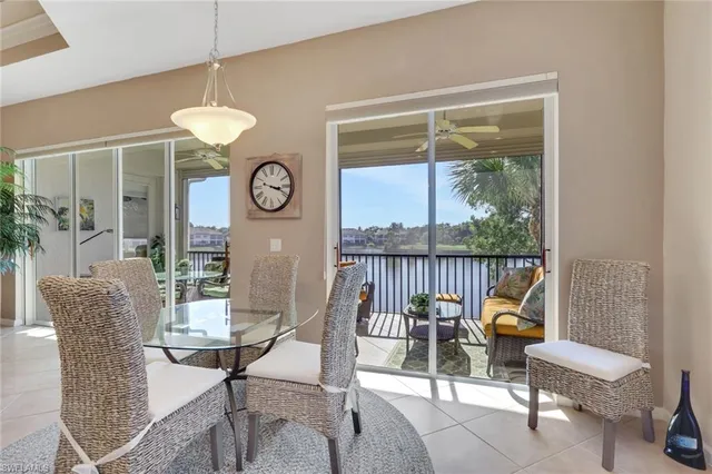 a view of a dining room with furniture wooden floor and a chandelier