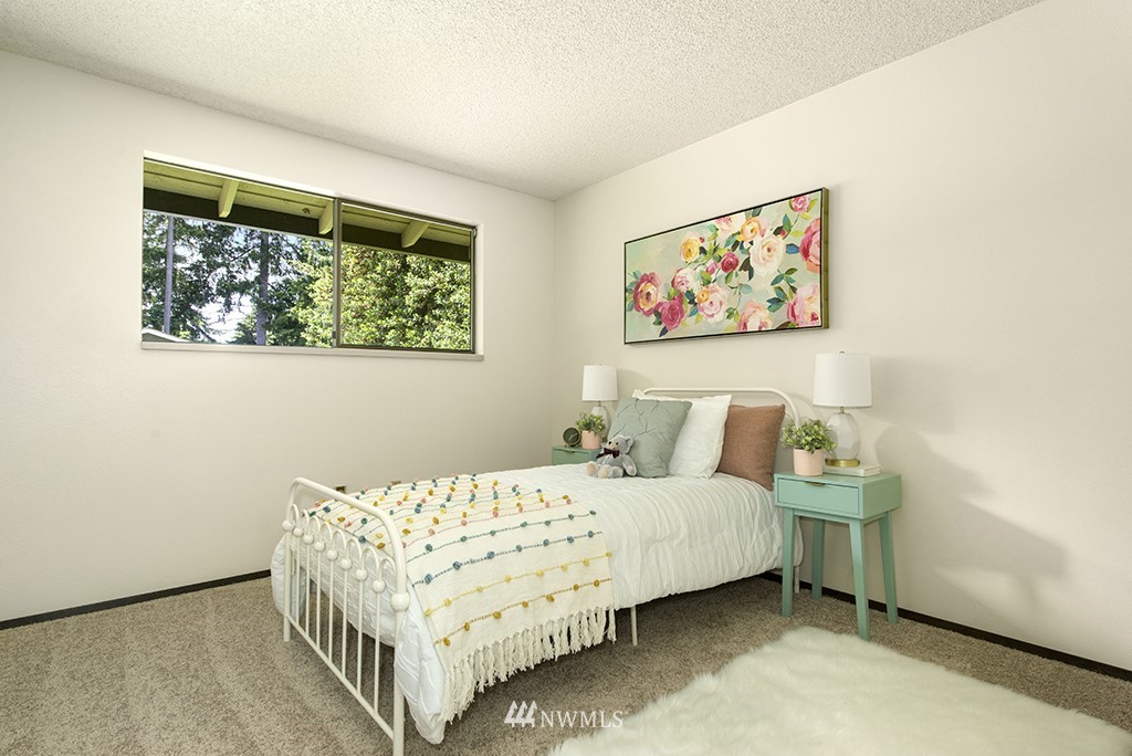 14413 157th Place Southeast Renton, WA 98059 - Photo 16 of 29 a bedroom with a bed and a window