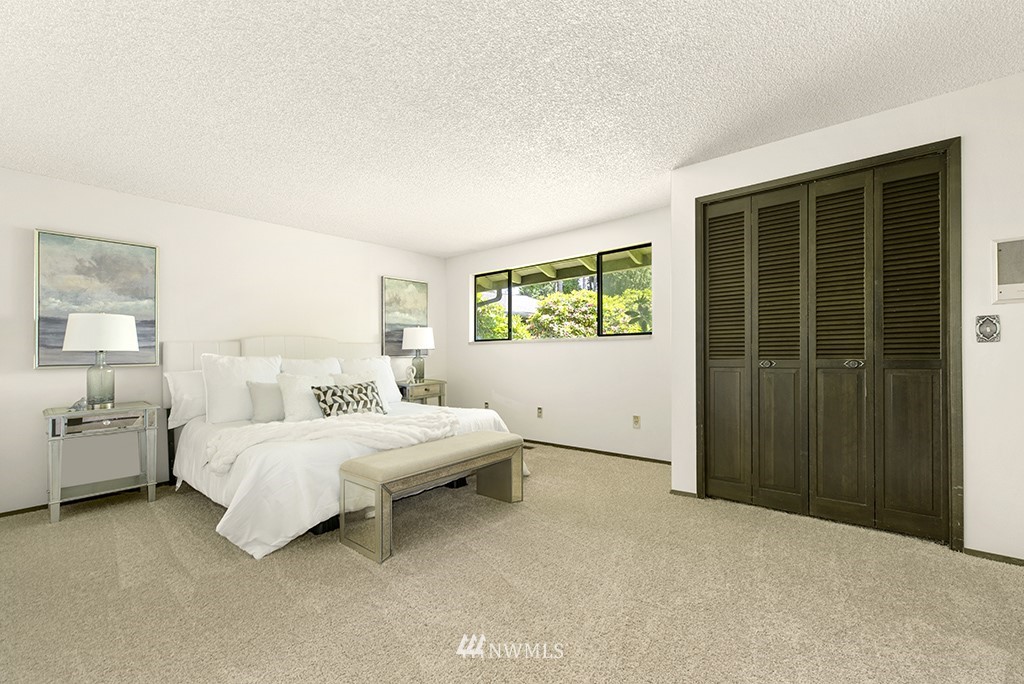 14413 157th Place Southeast Renton, WA 98059 - Photo 18 of 29 a bedroom with a bed and a window