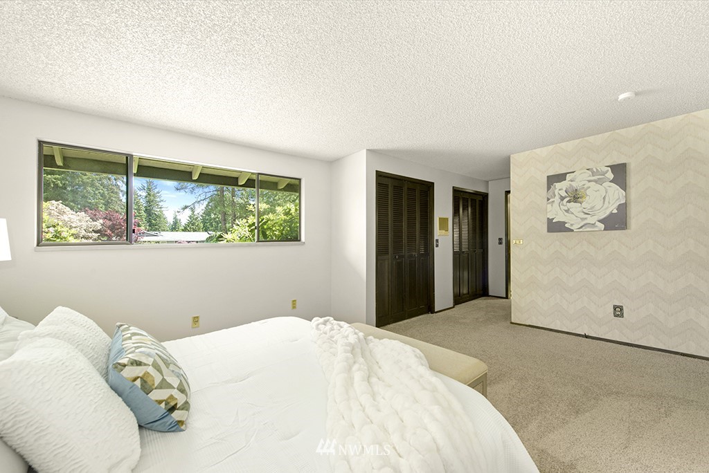 14413 157th Place Southeast Renton, WA 98059 - Photo 19 of 29 a bedroom with a bed and a large window