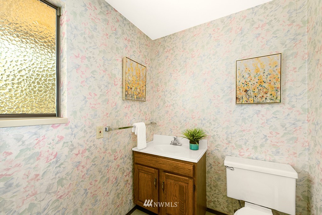 14413 157th Place Southeast Renton, WA 98059 - Photo 23 of 29 a bathroom with a sink and a mirror