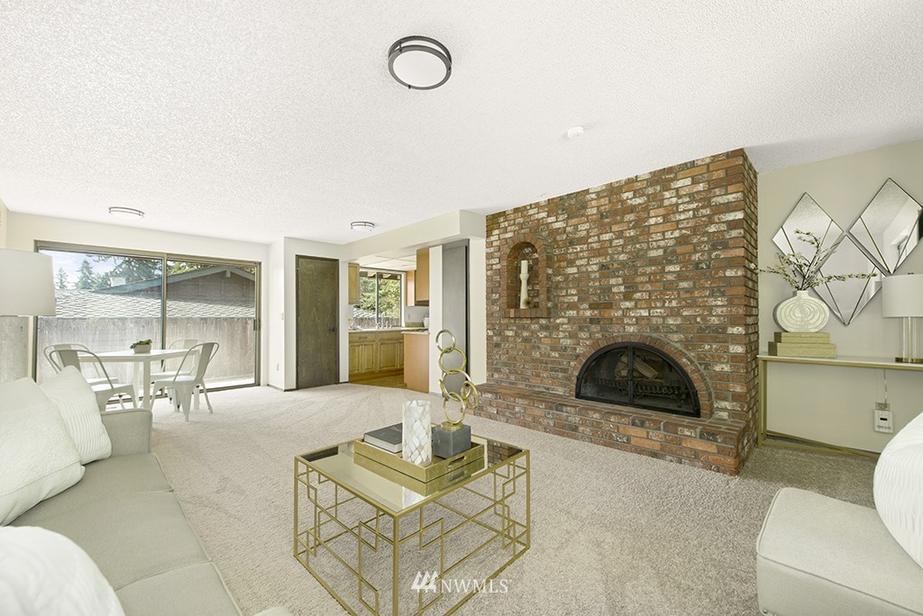14413 157th Place Southeast Renton, WA 98059 - Photo 5 of 29 a living room with furniture and a fireplace