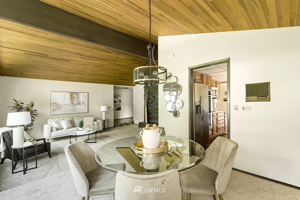 14413 157th Place Southeast Renton, WA 98059 - Photo 10 of 29 a dining room with furniture and a chandelier