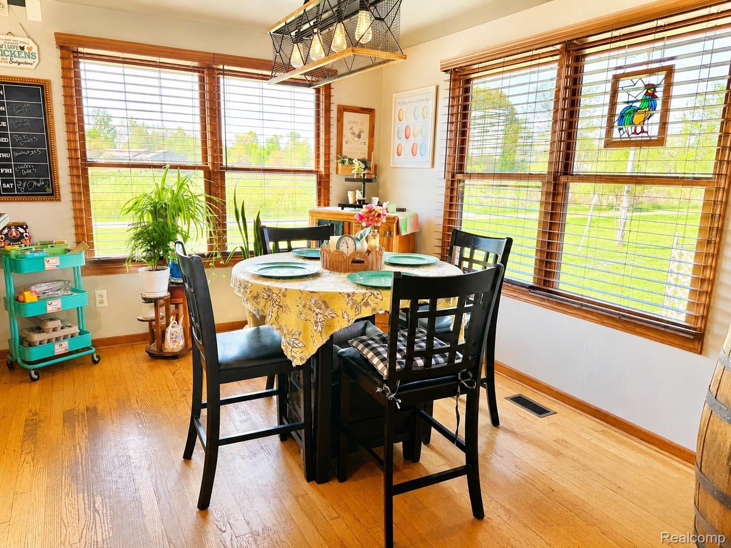 6860 Grand River Road Bancroft, MI 48414 - Photo 9 of 31 Dining space featuring baseboards and light wood-type flooring