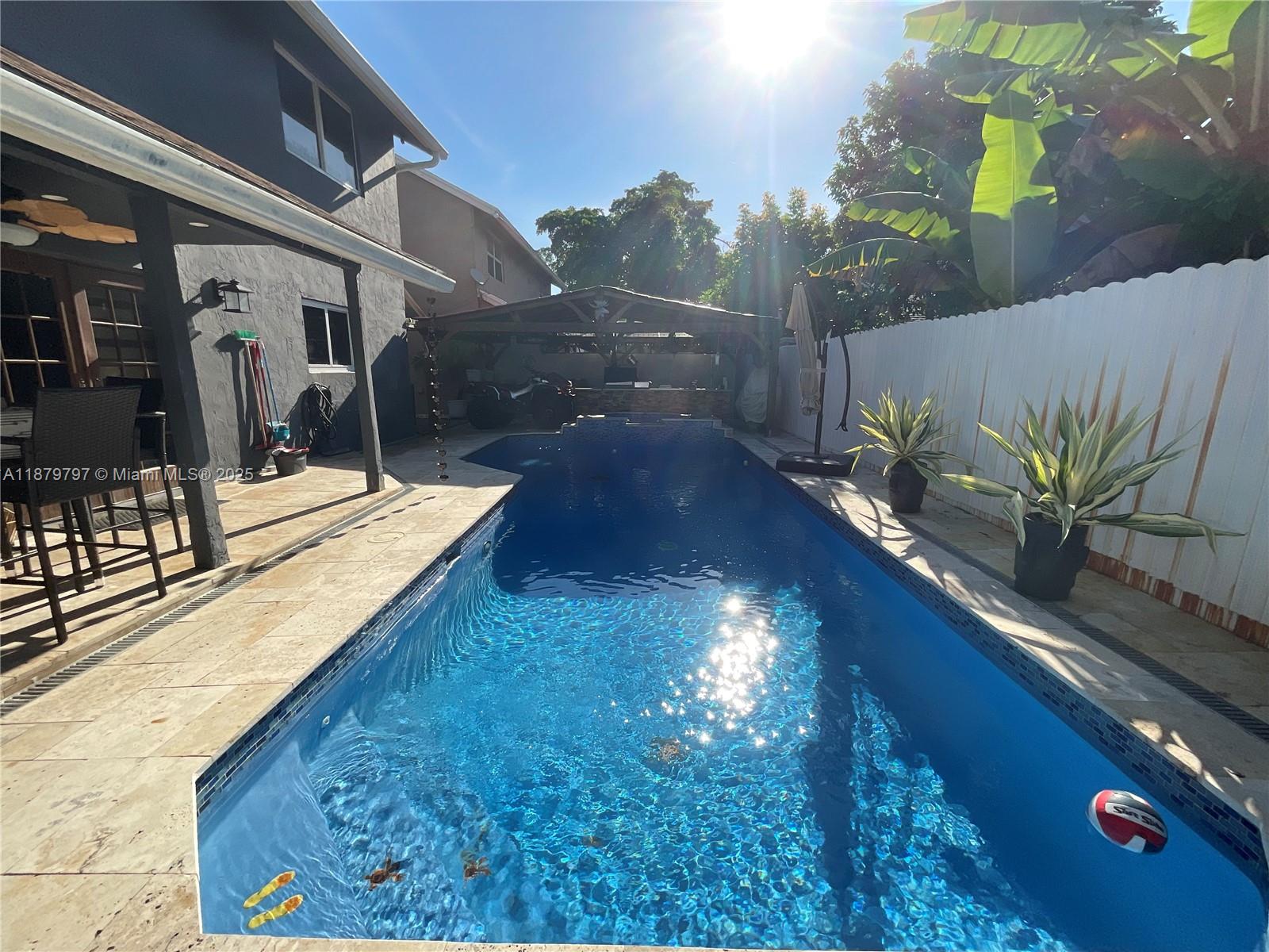 9710 Southwest 13th Street, Unit 9710 Pembroke Pines, FL 33025 - Photo 14 of 43 a view of a balcony with chairs