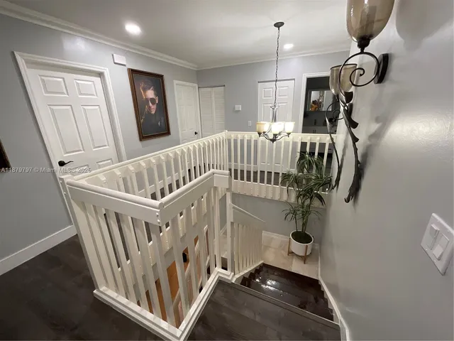 a bedroom with a bed and a mirror