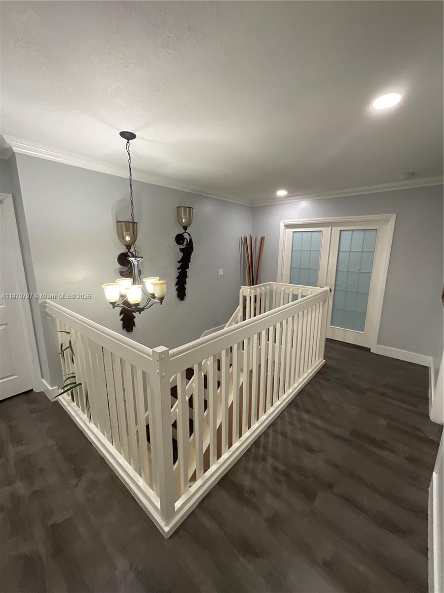9710 Southwest 13th Street, Unit 9710 Pembroke Pines, FL 33025 - Photo 21 of 43 a view of a hallway with wooden floor