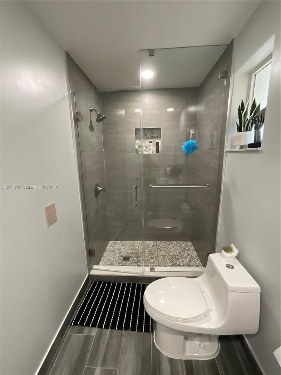 9710 Southwest 13th Street, Unit 9710 Pembroke Pines, FL 33025 - Photo 24 of 43 a bathroom with a sink and mirror