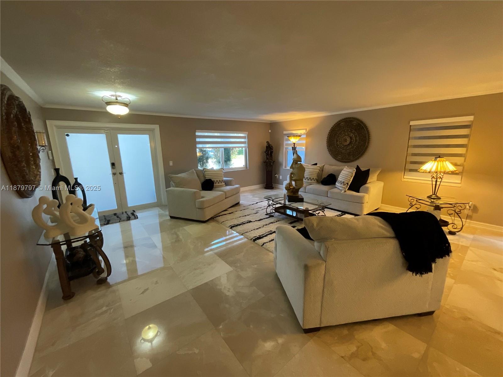 9710 Southwest 13th Street, Unit 9710 Pembroke Pines, FL 33025 - Photo 4 of 43 a living room with furniture and a window