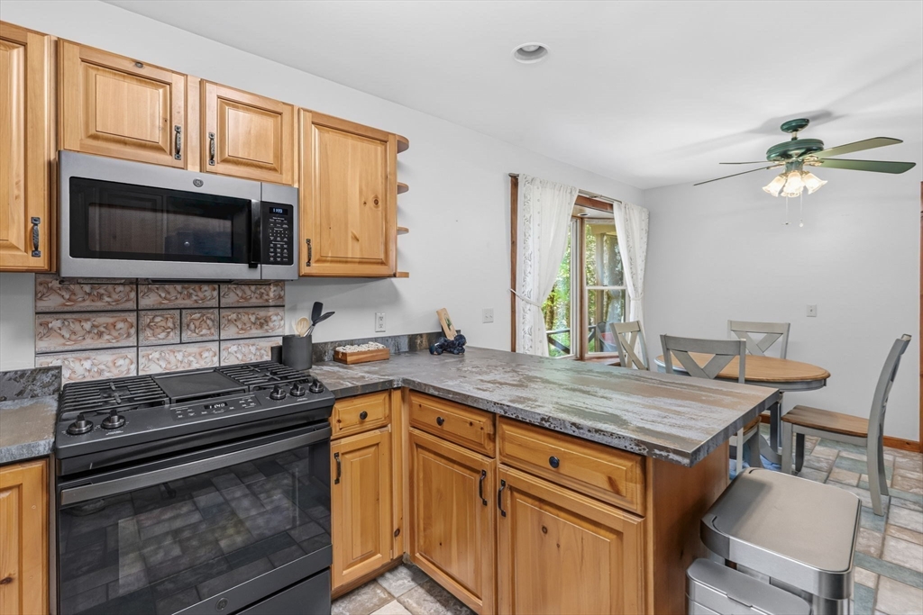 345 Harvey Road Worthington, MA 01098 - Photo 18 of 41 a kitchen that has a stove and a microwave