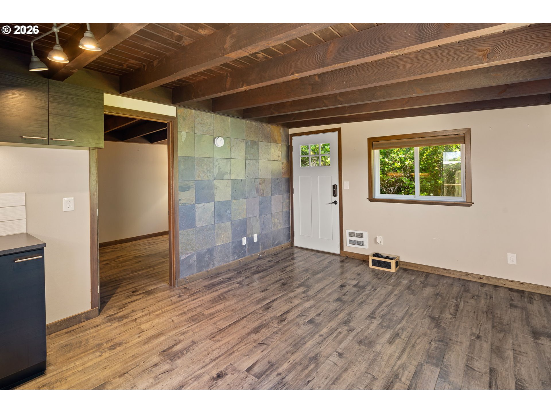 88481 1st Avenue Florence, OR 97439 - Photo 24 of 43 a view of an empty room with window and wooden floor