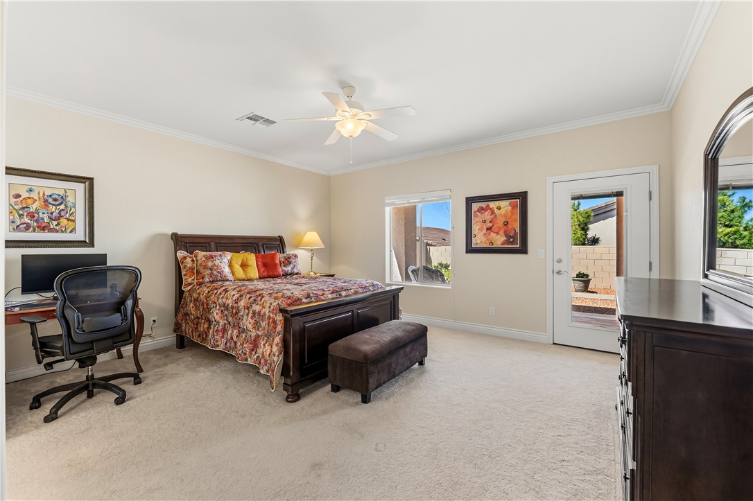 3315 Rainbow Mine Road Kingman, AZ 86401 - Photo 18 of 54 This spacious room features neutral toned walls, carpeting, and crown molding