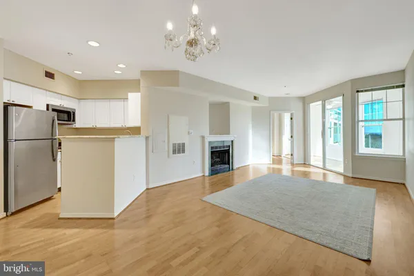 a view of empty room with a fireplace