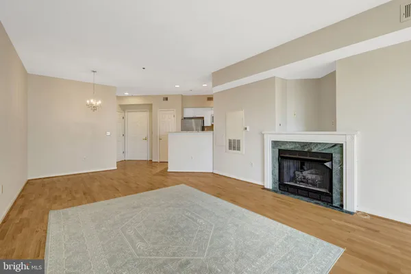 a bathroom with a sink a toilet and a large mirror