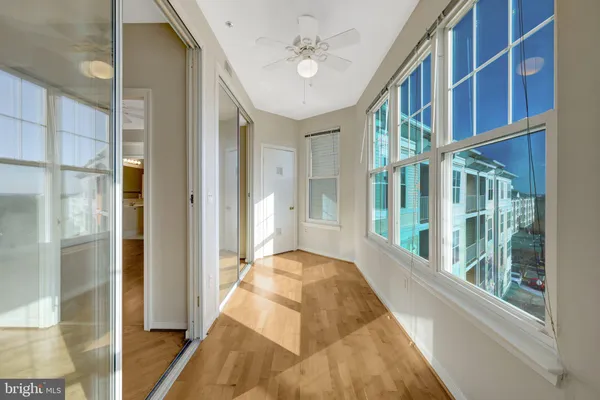 a bathroom with a granite countertop sink a mirror and a shower
