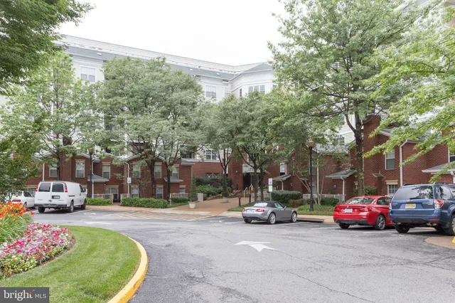 a bedroom with furniture and a large mirror